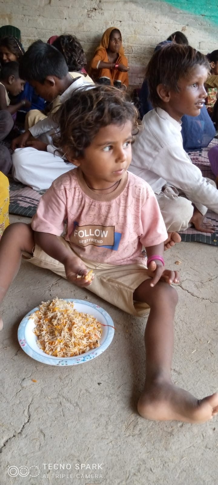 A child with a plate of food